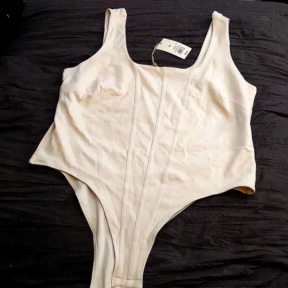 Never been worn XXL white body suite